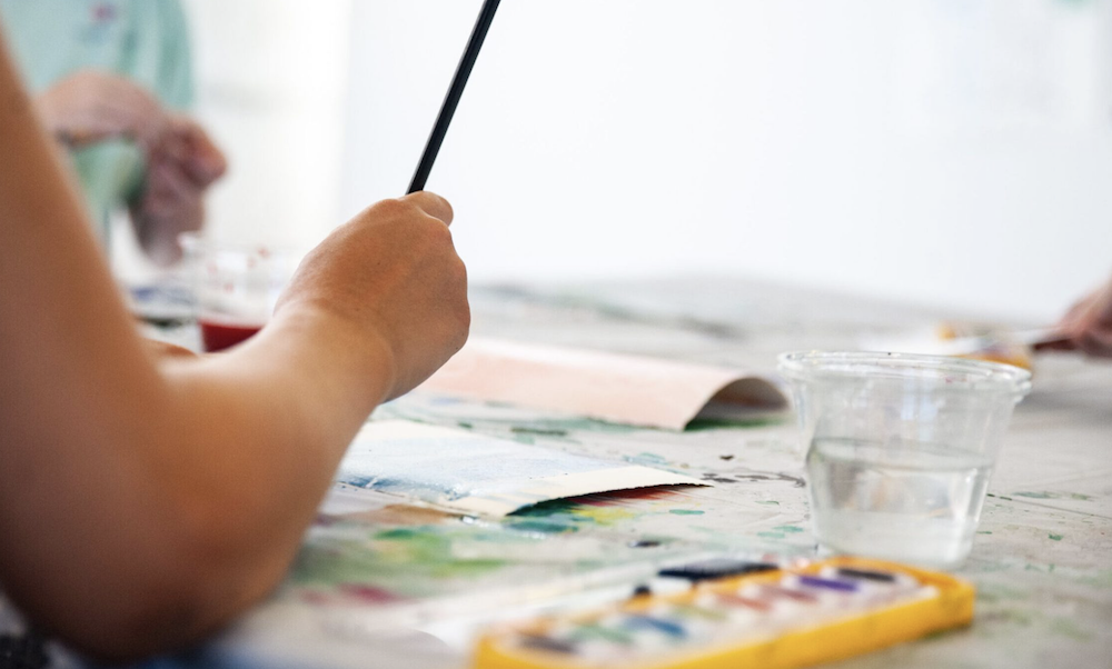a person holding a brush